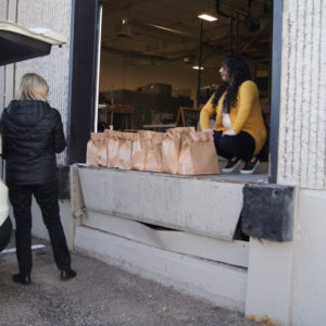 Picking up food bags from the loading dock.