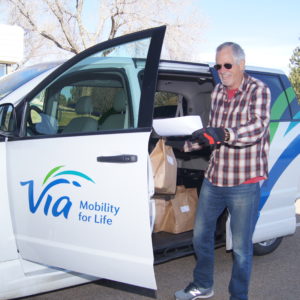 Via Volunteer picking up food from Boulder County Farmers Market's Longmont warehouse.